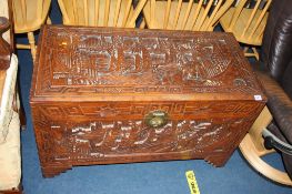 A large Oriental carved camphorwood chest, 101cm wide
