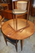 After Frem Rojle, an American teak circular table, with four chairs by Narco Furniture Inc.