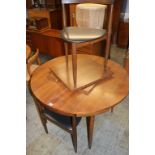 After Frem Rojle, an American teak circular table, with four chairs by Narco Furniture Inc.