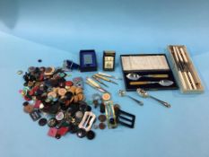 Various buttons, cutlery etc.