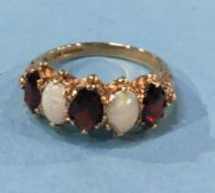 A 9k opal and garnet ring, size O, 3.1g