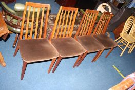 A set of four teak G Plan dining chairs