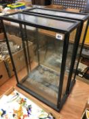 Two glass display cabinets