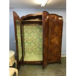 An Art Deco walnut three door wardrobe