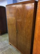 A mahogany fitted wardrobe