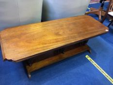 An elephant coffee table, with three carved elephant supports