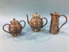 A Middle Eastern silver coloured teapot, water jug and sugar bowl, weight 16.9oz