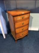 A decorative bow front bedside chest, painted with flowers, 41cm wide