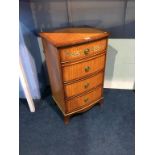 A decorative bow front bedside chest, painted with flowers, 41cm wide