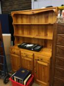 A pine dresser, drop leaf table and chairs