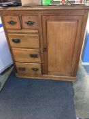 An Edwardian cabinet, with single cupboard door, alongside two short and three long drawers