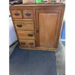 An Edwardian cabinet, with single cupboard door, alongside two short and three long drawers