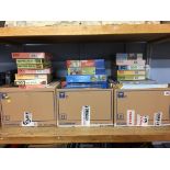 A shelf of boxed jigsaw puzzles