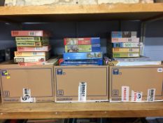 A shelf of boxed jigsaw puzzles