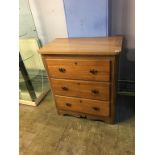 A chest of three drawers