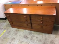 A teak chest of drawers