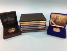 A Trafalgar silver proof Crown, a Concorde silver proof £5 coin and the Royal Mail Edward VII George