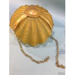 A scallop shell shaped hanging light shade