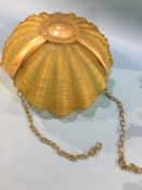 A scallop shell shaped hanging light shade