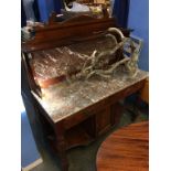 A walnut marble top and backed washstand