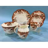 A fine bone china partial tea set, 11 cups, two plates, one large bowl, one small bowl, one jug,