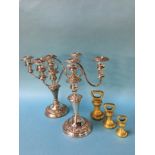 Two silver on copper candelabras, plus three brass weights