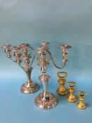 Two silver on copper candelabras, plus three brass weights