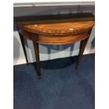 A 19th century mahogany fold over card table