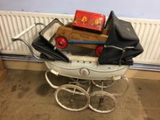 A vintage pram, doll, Triang baby walker etc.