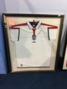 Autographed football, signed Wayne Rooney, framed England strip 2003, his first game