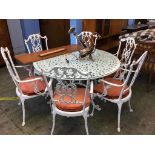 A large metalwork garden table and six chairs