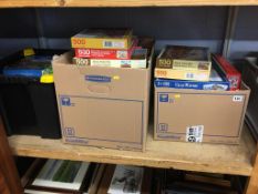 A shelf of boxed jigsaw puzzles