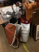 Two sets of golf clubs