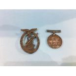 A 1914-1918 medal awarded to 472343 SPR W. Morton RE and a German World War II Luftwaffe brooch