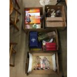 Four boxes of assorted glassware, Royal Doulton figures etc.