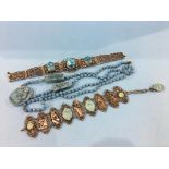 Two Oriental scarab bracelets and a long bead necklace