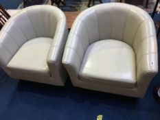 Pair of cream leather tub chairs