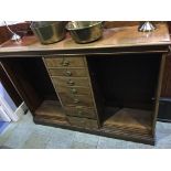 A mahogany bookcase with seven central drawers, flanked by two open bookcase shelves, 154cm wide