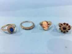 Three 9ct gold dress rings and another stamped 18ct, total weight 9.9 grams