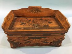 An Oriental sarcophagus shaped wooden jewellery box