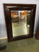 A large walnut oyster veneer framed wall mirror