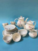 A Royal Doulton Pillar Rose tea set, six cups, six saucers, six smaller plates, one sugar bowl,