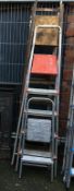 Four sets of step ladders