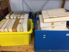 A shelf of boxed commemorative plates