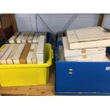 A shelf of boxed commemorative plates