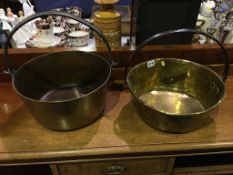 A pair of brass jam pans