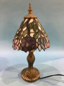 A small modern Tiffany style table lamp and shade