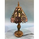 A small modern Tiffany style table lamp and shade