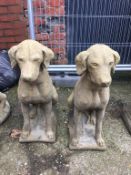 Pair of composite seated dogs