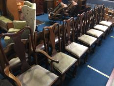 A set of seven mahogany Queen Anne style dining chairs, comprising 6 single and 1 carver